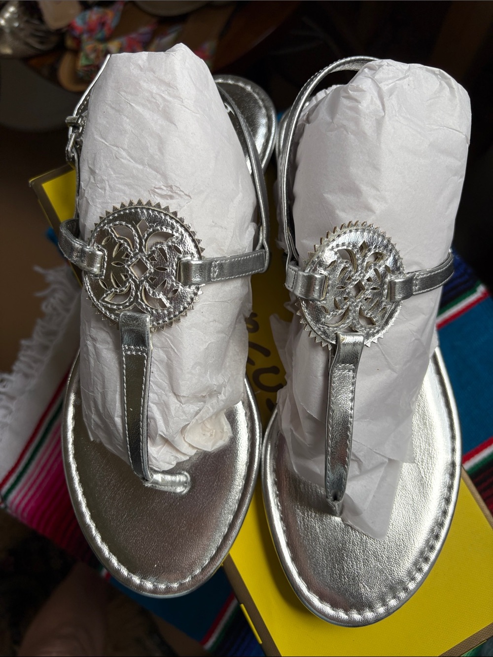 Women's Metallic Silver T-Strap Sandals with Decorative Emblem